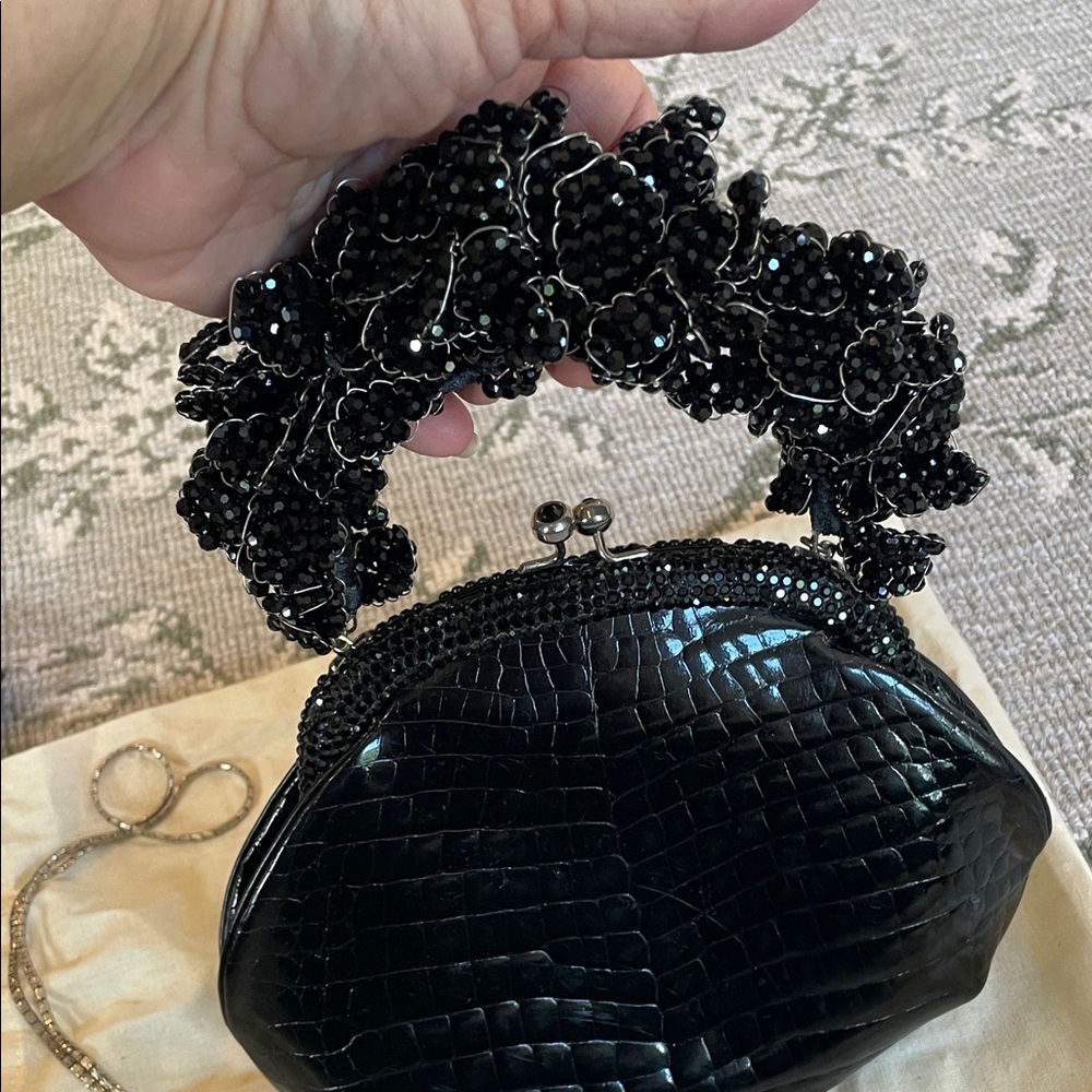 VINTAGE Black Crocodile Judith Leiber with black diamond frame .
